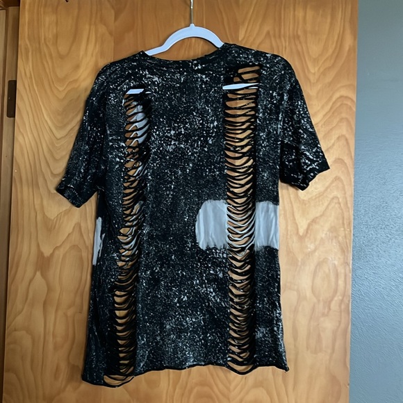 Trendy. tee With distressed on it. Size large - Picture 2 of 2